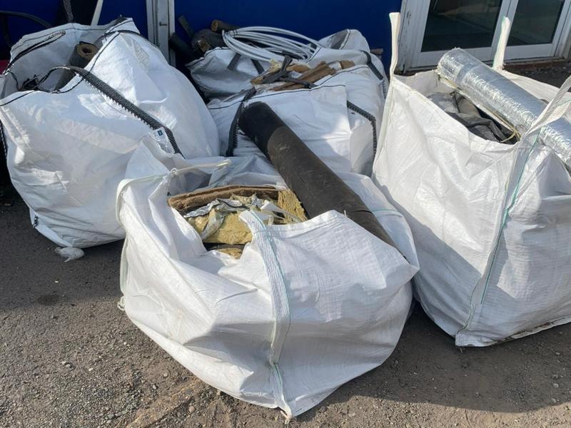 Bulk bags of waste outside a commercial building before collection