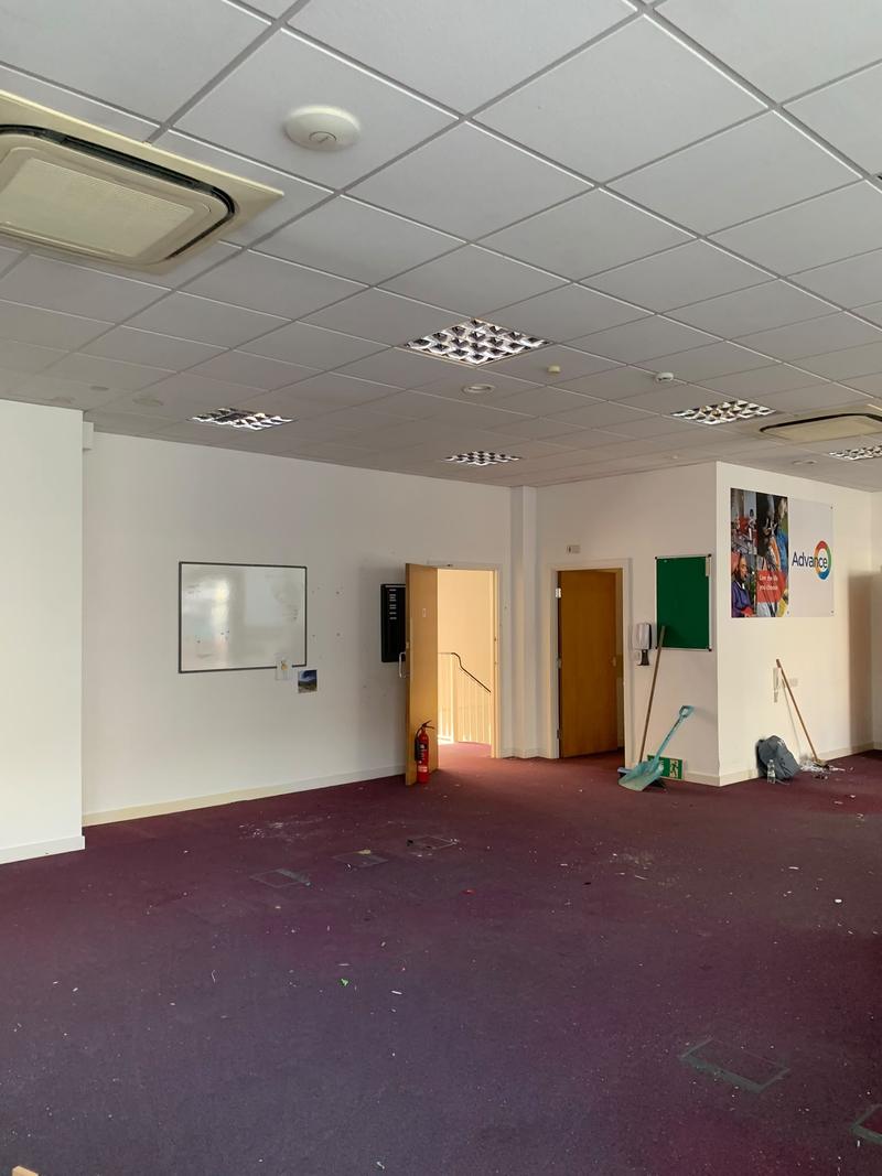 Office after the bulk contents were removed; tools and some small debris remain
